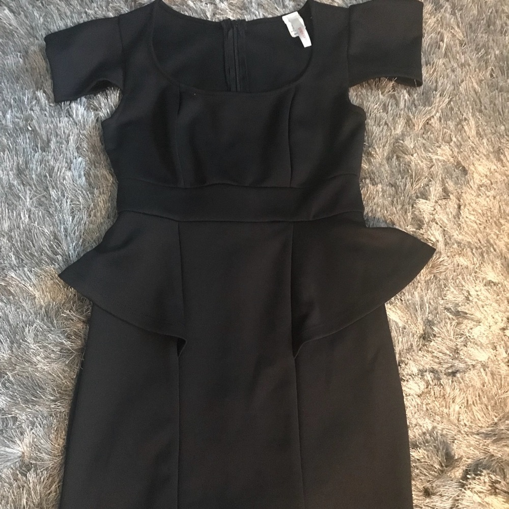 Black mini peplum with capped sleeves